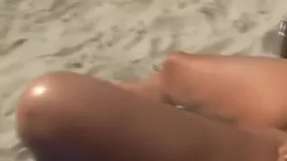 aged woman widens her fur pie to show her bush during the time that this babe is tanning on the beach