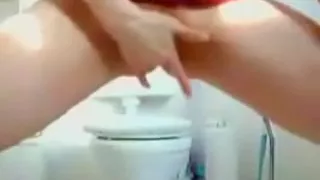 Leggy girl fingers her neat twat