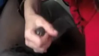 A darksome cock in a white hand