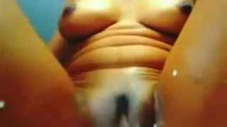 Lovely ebony whore masturbates