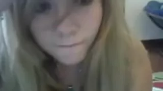 Cute golden-haired angel undresses on web camera