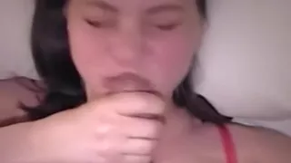 Smiling wife sucking cock