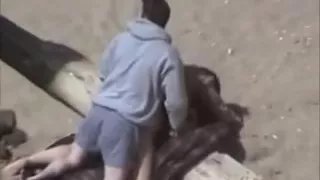 amateur couple having sex on the beach