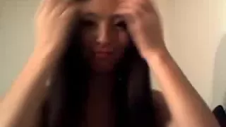 Asian gal spreads legs and masturbates