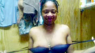 Young Ebony teen strip teases on cam