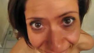 Hot brunette gets sperm on her face