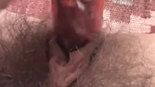 Awesome babe wanks her hirsute slit with a dildo