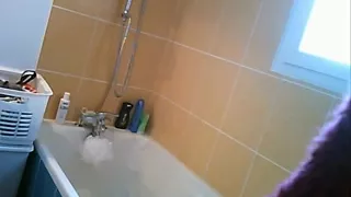 Hot chick showers in voyeur video