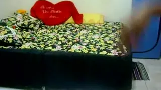 Shaking her bare ass to music