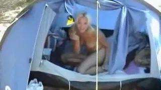 Hot blonde girlfriend shows love for her boyfriend and does a great footjob sex in their tent ending with cumshot on her hands while rubbing him hard
