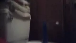 Riding blue dildo in a bathroom