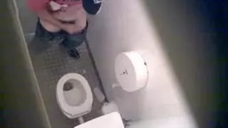 Cute gay masturbating in the toilet