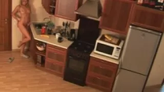 Blonde chick naked in the kitchen