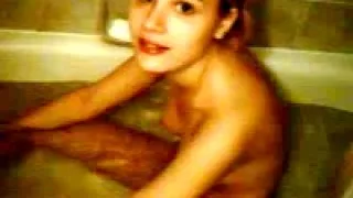 Bathtub fun for a naked teenager