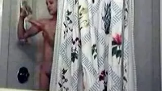 Girl gets filmed while showering