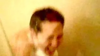 Girl films her friend showering