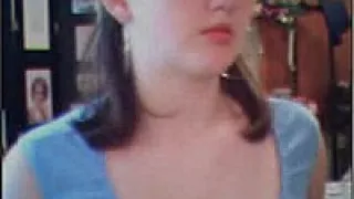 Young teenage cutie posing on her webcam