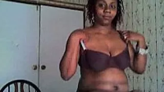 Cute black chick undressing