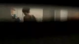 A voyeur spies through a window porno