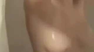 Amateur girl with GREAT boobs in shower.