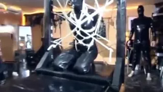 Latex Slave Tied Up In Bondage