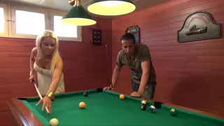 This blonde enjoys playing pool today