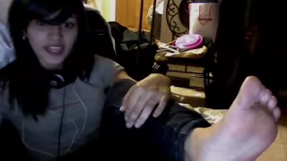 feet to the camera and singing (youtube original)