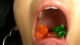 Two hot girls swallow gummy bears and worms
