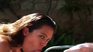 Beautiful brunette oils up to fuck on a tarp