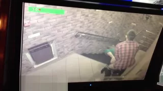 The couple in front of camera surveillance