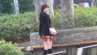 Asian teen pulls up skirt