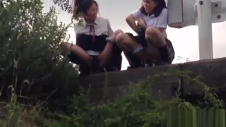 Teens peeing in field