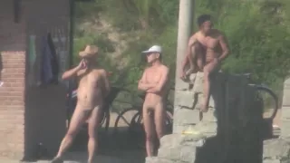 Chinese Men swimming at lake