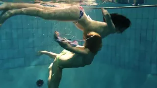 Two sexy amateurs showing their bodies off under water