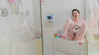 Emma Evins using a shower head to masturbate