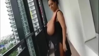 Big natural boobs on balcony