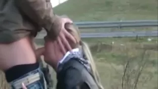 Blonde gives a public blowjob