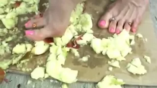 Teen crushing apple's barefoot