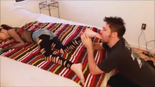 guy lick sleeping feet