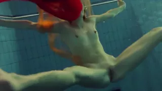 Yellow and Red clothed teen underwater