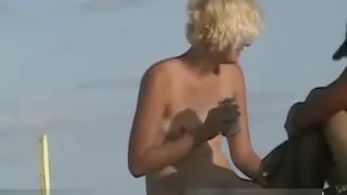 Naked hotties followed around by a nude beach voyeur