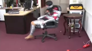 Angry girl taped to chair