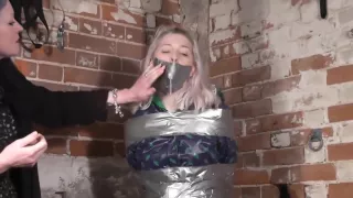 Woman mummified by woman
