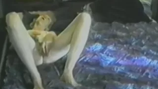 Amateur blonde mature toys her pussy in bed