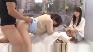 A young Japanese girl in front of a friend