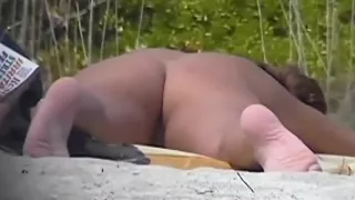 Naked hotties followed around by a nude beach voyeur