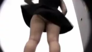 Asian teen can't do anything against the wind that lifts her dress up !