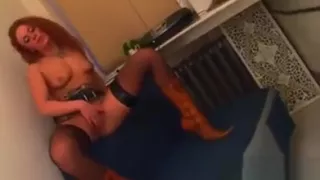 Redhead Wearing Fishnets Gets Naked