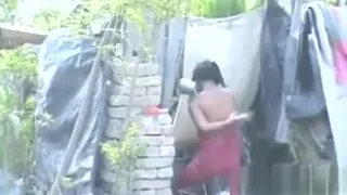 Poor Woman Washing Her Body Outdoors
