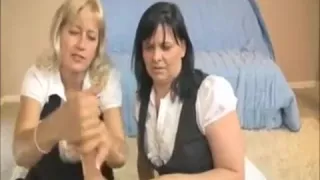 Two Milfs Jacking Off The Thick Cock